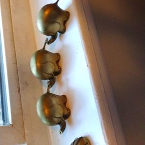 Three brass elephants that connect